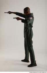 ERIC STANDING POSE WITH GUNS